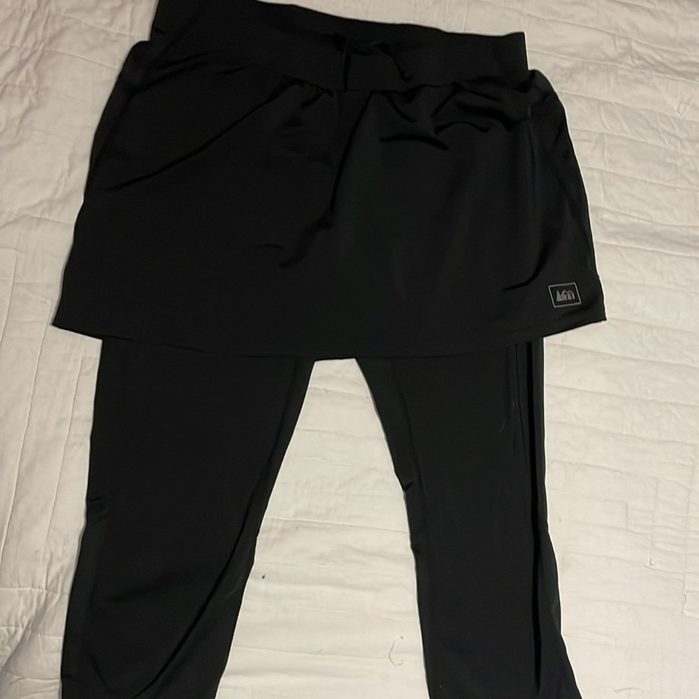 REI black womens skirt with built in capri leggings.  Size small